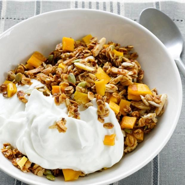 sweet debbie's mangolicious magic granola that is sugar-free, gluten-free and organic with dried mango and sprouted nuts and seeds.